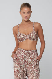 This is an image of Pepper Bra Top in Dallas - RESA featuring a model wearing the dress