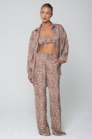 This is an image of Pepper Bra Top in Dallas - RESA featuring a model wearing the dress