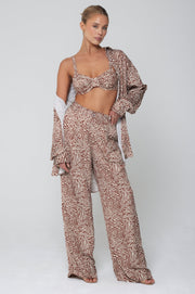 This is an image of Pepper Bra Top in Dallas - RESA featuring a model wearing the dress