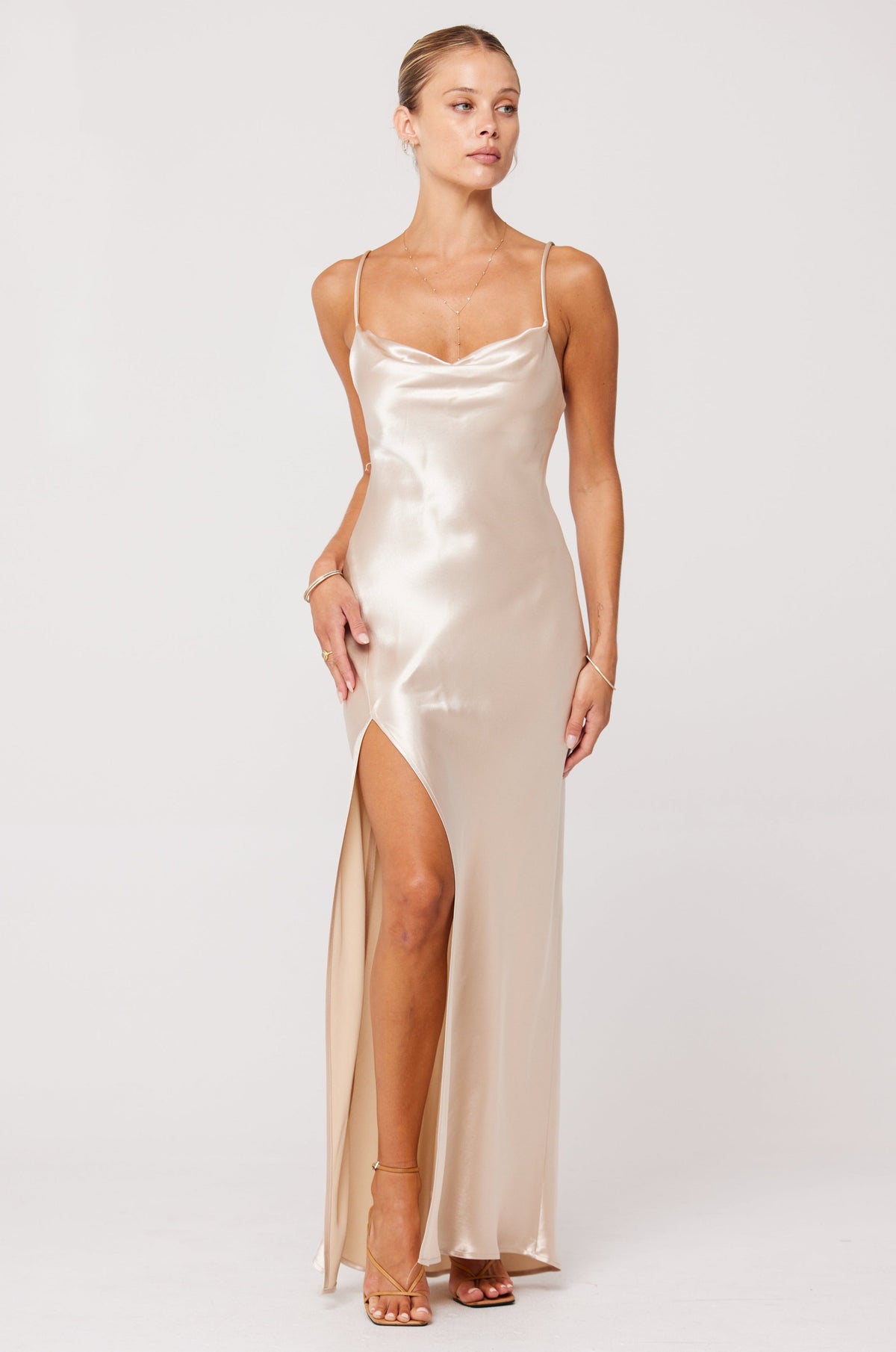 This is an image of River Slip in Champagne - RESA featuring a model wearing the dress