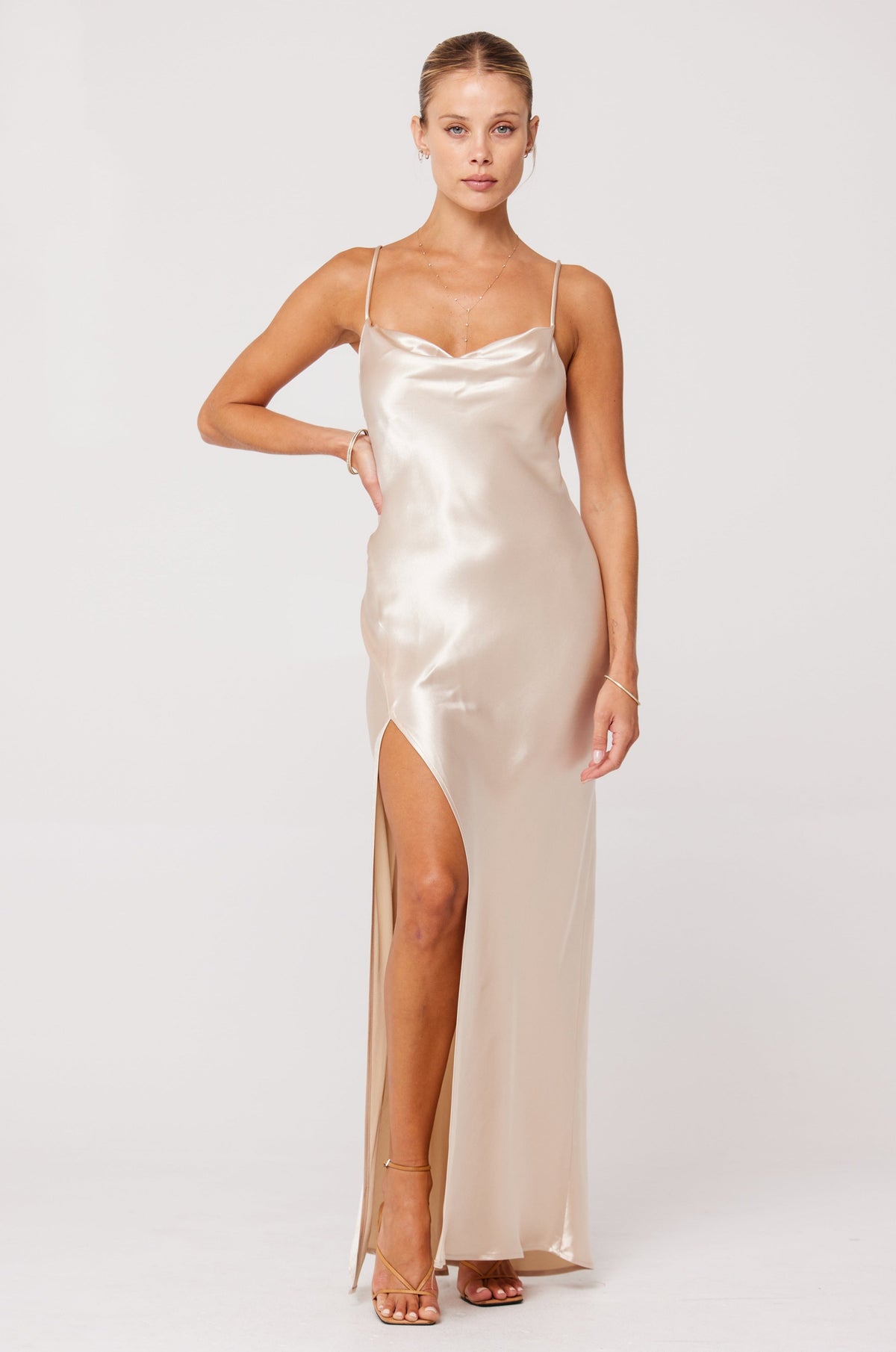 This is an image of River Slip in Champagne - RESA featuring a model wearing the dress