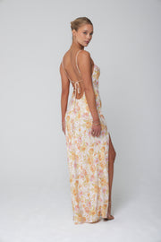 This is an image of River Slip in Gardenia - RESA featuring a model wearing the dress