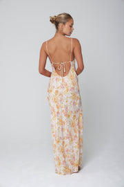 This is an image of River Slip in Gardenia - RESA featuring a model wearing the dress