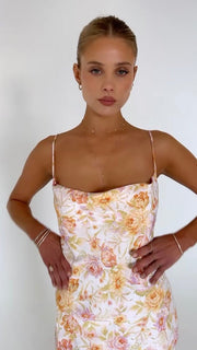 This is an image of River Slip in Gardenia - RESA featuring a model wearing the dress