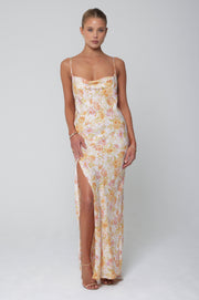 This is an image of River Slip in Gardenia - RESA featuring a model wearing the dress