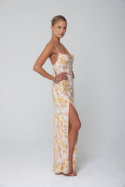 This is an image of River Slip in Gardenia - RESA featuring a model wearing the dress