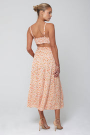 This is an image of Skatie Skirt in Sunstone - RESA featuring a model wearing the dress