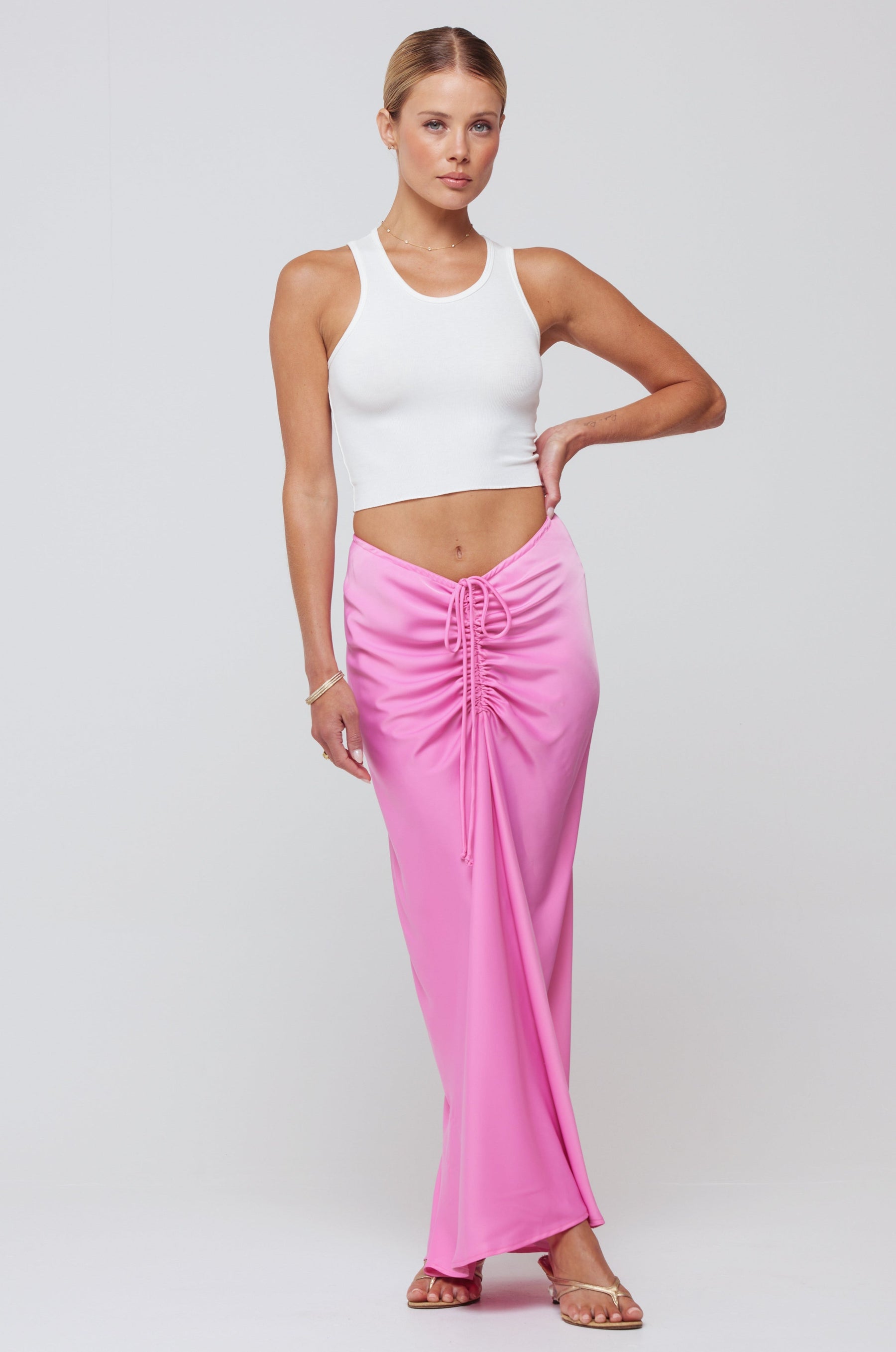 This is an image of Ziggy Skirt in Dragon Fruit - RESA featuring a model wearing the dress