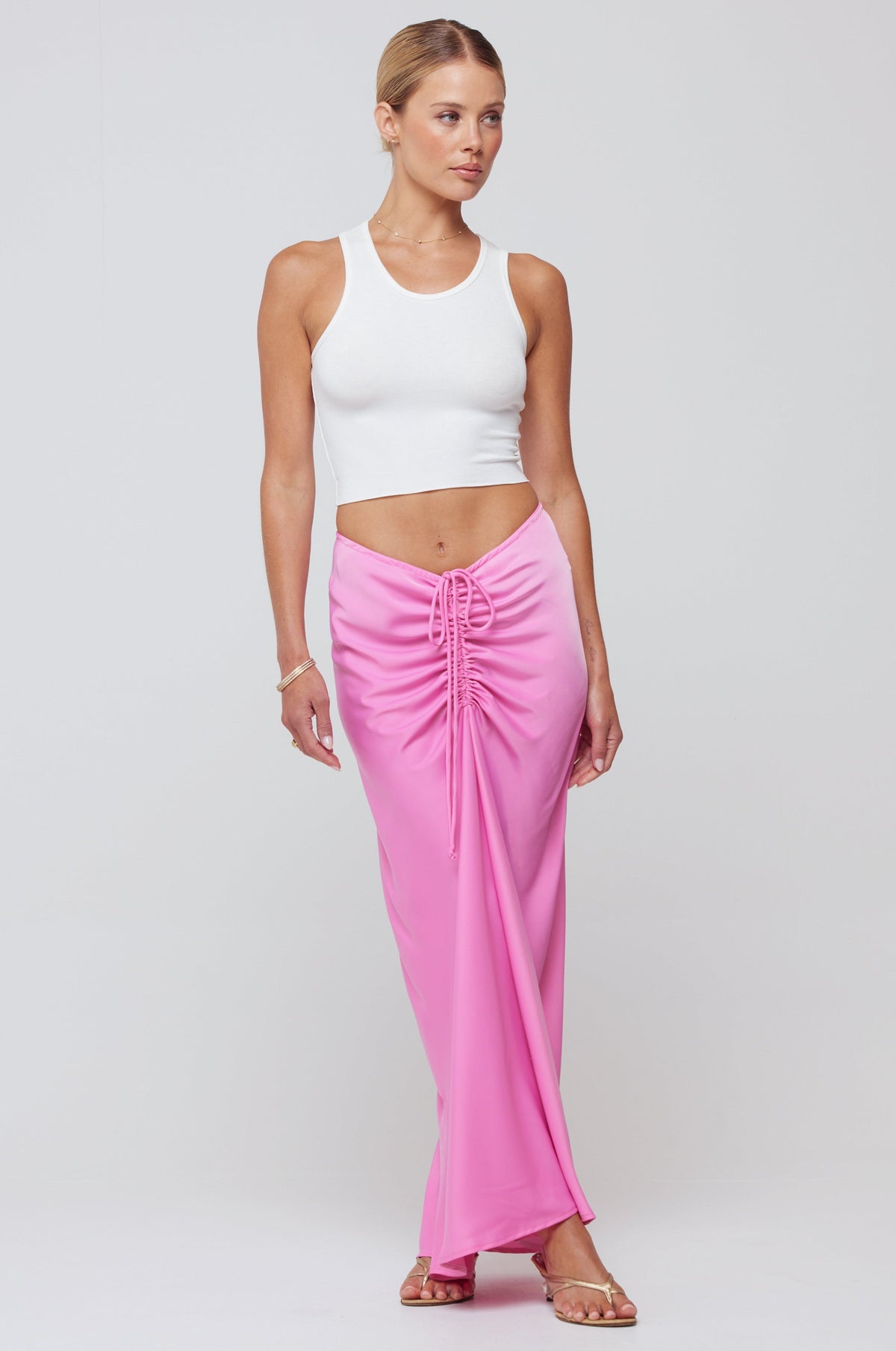 This is an image of Ziggy Skirt in Dragon Fruit - RESA featuring a model wearing the dress