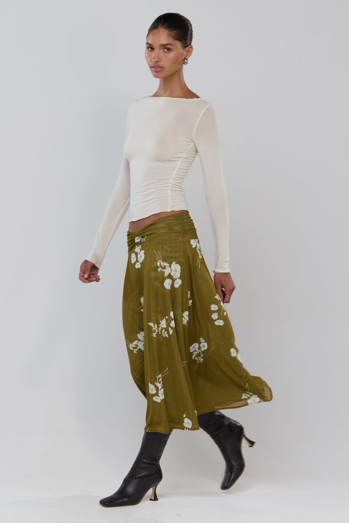 This is an image of Abby in Moss - RESA featuring a model wearing the dress
