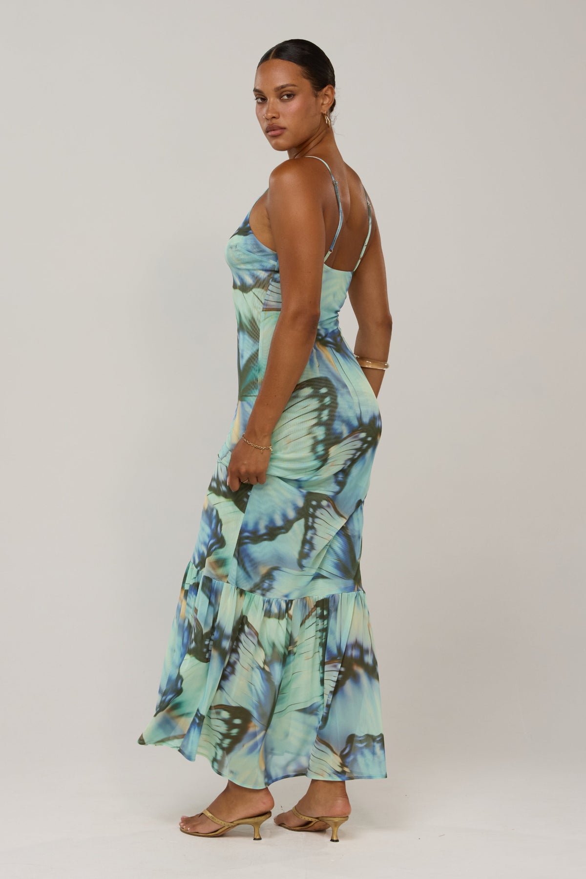 This is an image of Alejandra in Mariposa - RESA featuring a model wearing the dress