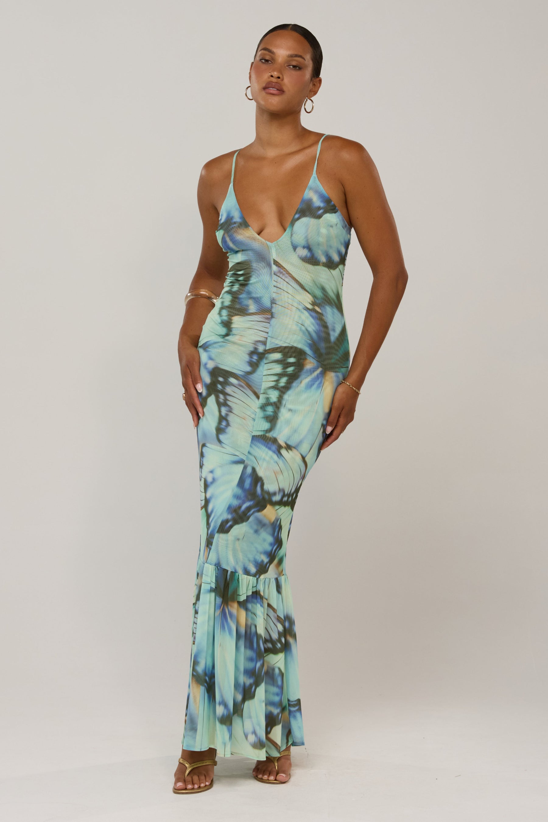 This is an image of Alejandra in Mariposa - RESA featuring a model wearing the dress