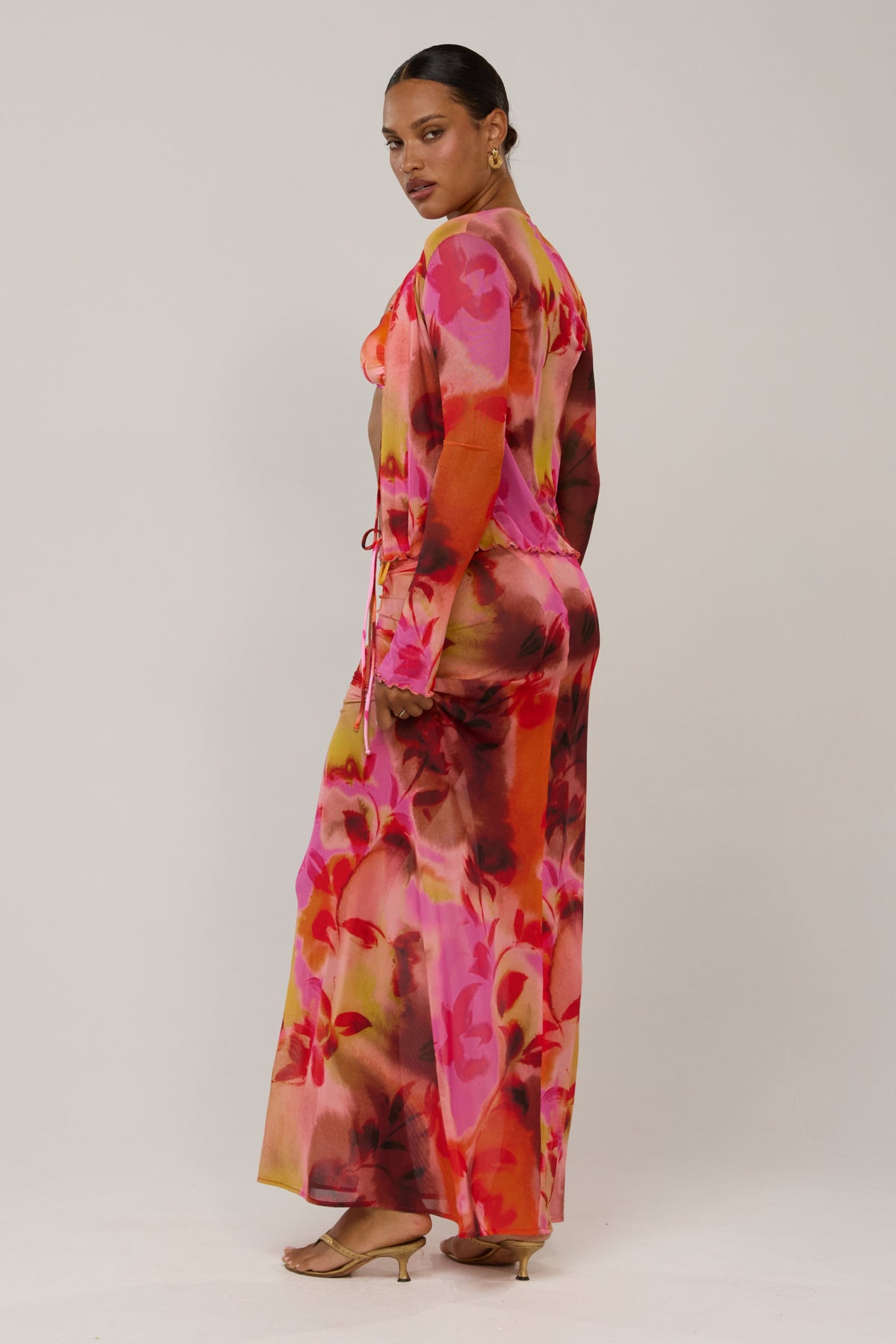 This is an image of Aliyah in Lilikoi - RESA featuring a model wearing the dress