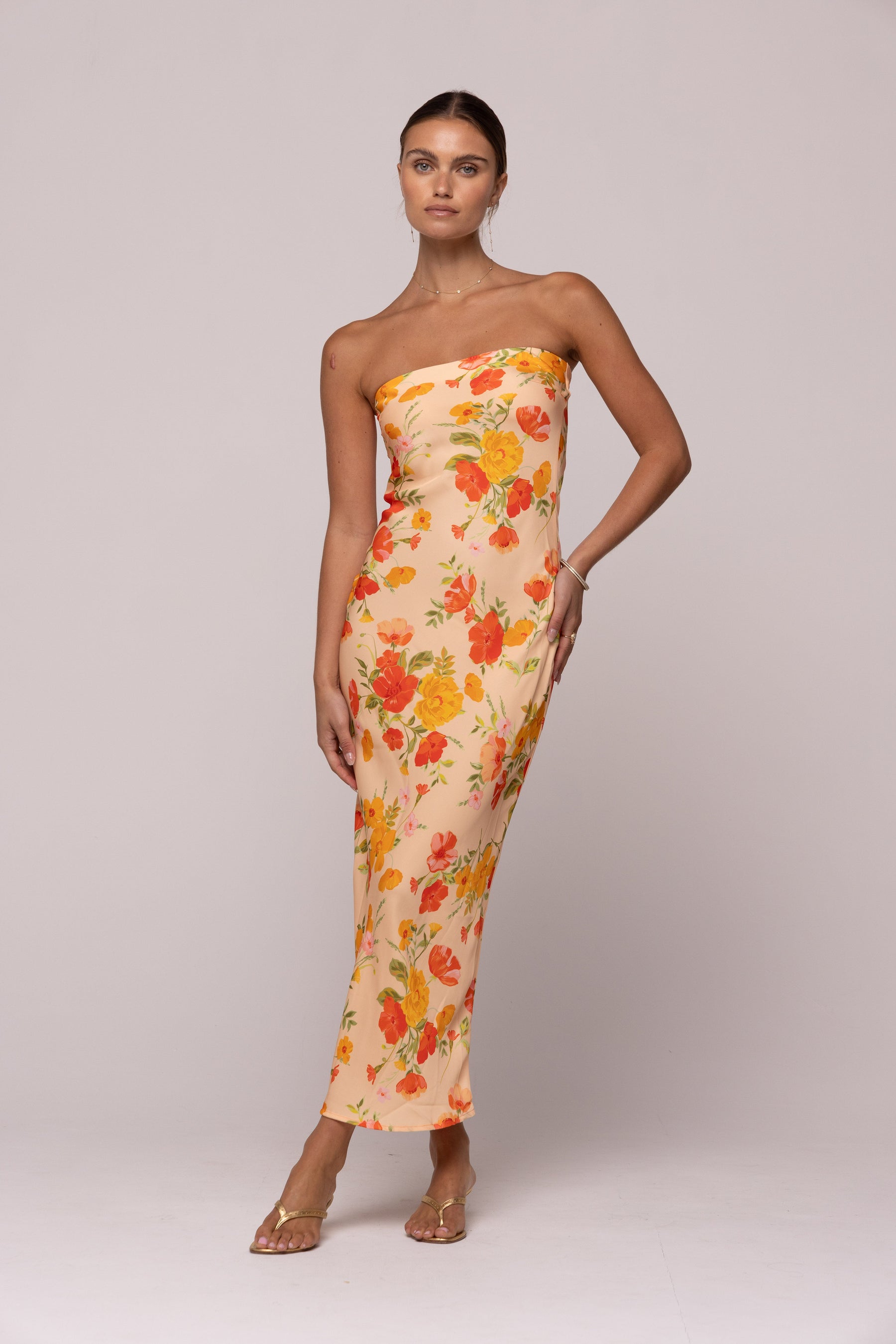 This is an image of ANNA DRESS IN GINGER - SAMPLE SALE - RESA featuring a model wearing the dress