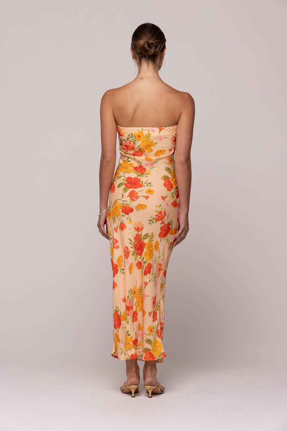 This is an image of ANNA DRESS IN GINGER - SAMPLE SALE - RESA featuring a model wearing the dress