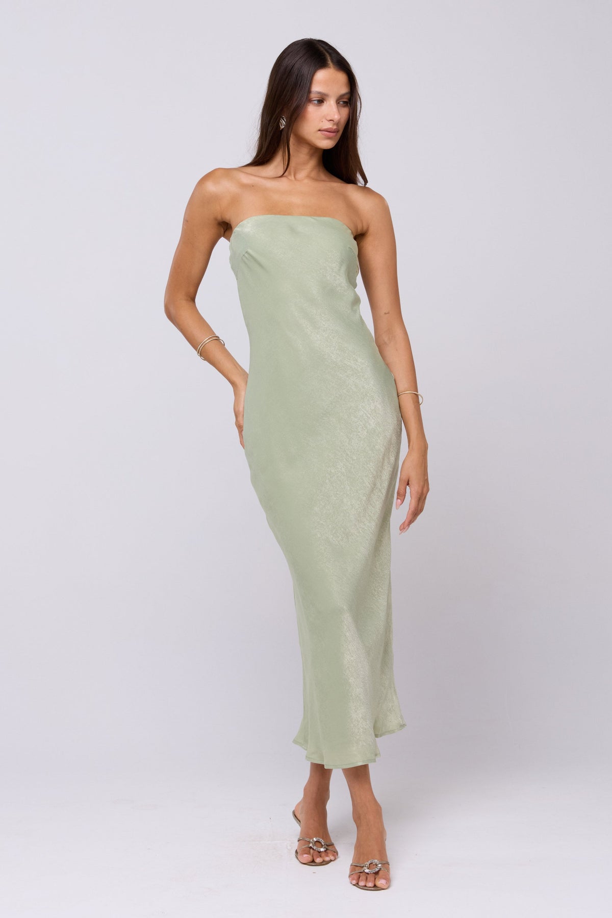 This is an image of Anna Slip in Sage - RESA featuring a model wearing the dress