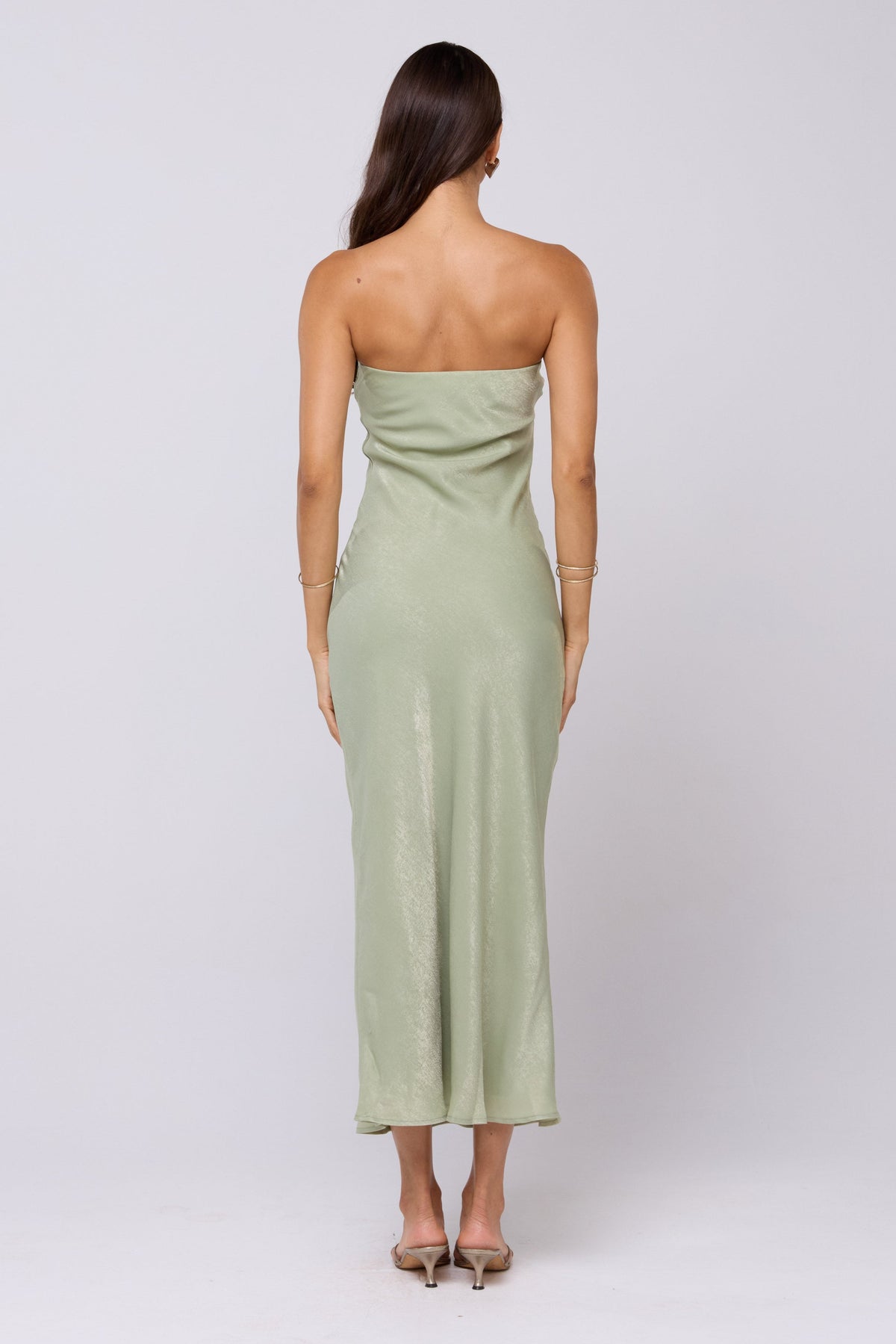 This is an image of Anna Slip in Sage - RESA featuring a model wearing the dress