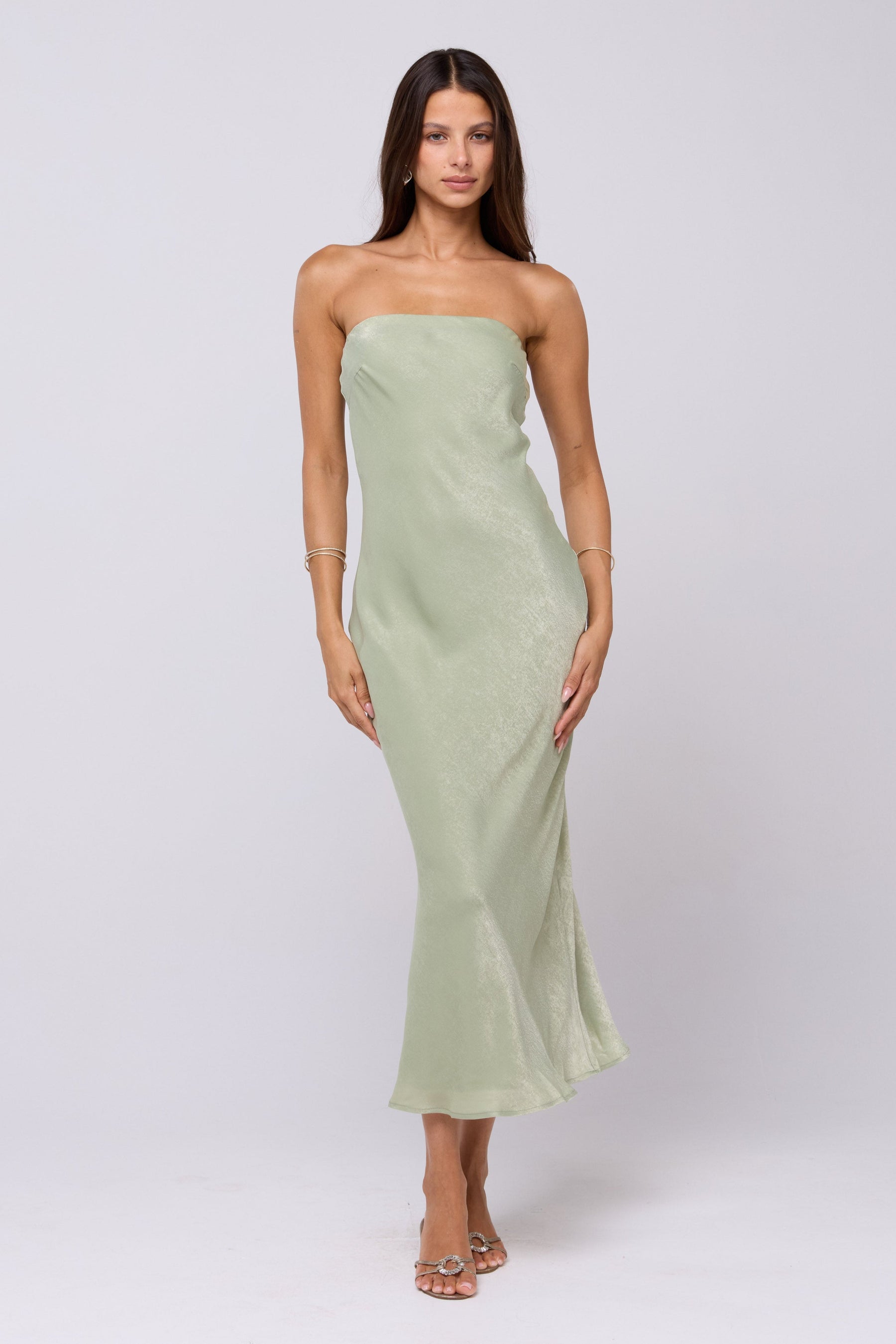 This is an image of Anna Slip in Sage - RESA featuring a model wearing the dress