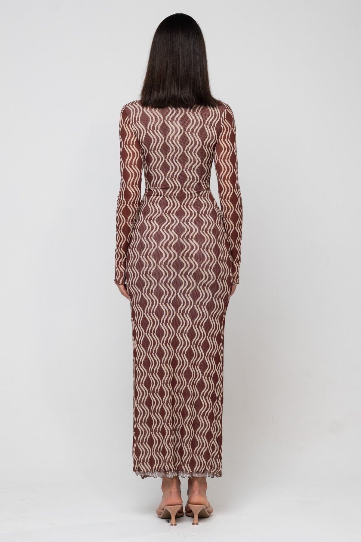 This is an image of Audrey Dress in Coco - RESA featuring a model wearing the dress