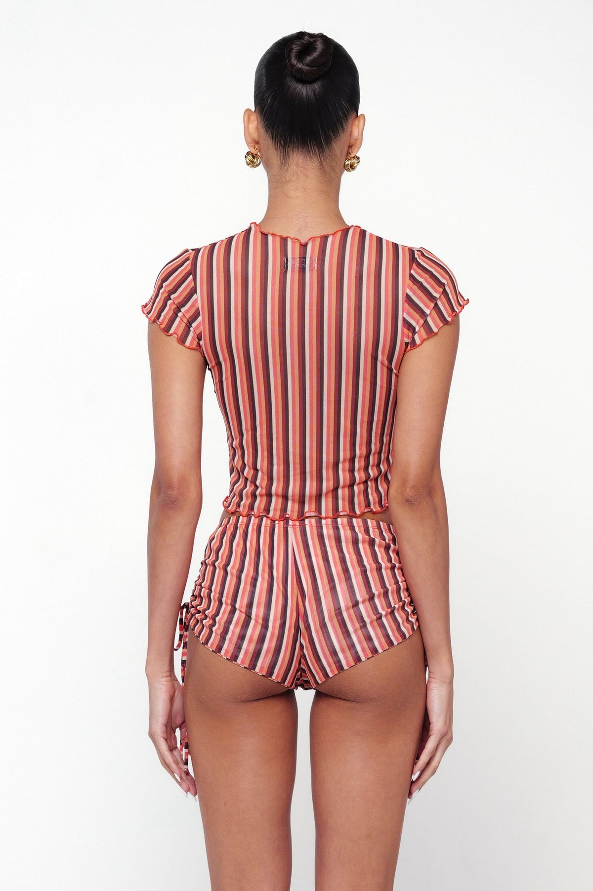 This is an image of Baby Tee in Studio 54 - RESA featuring a model wearing the dress