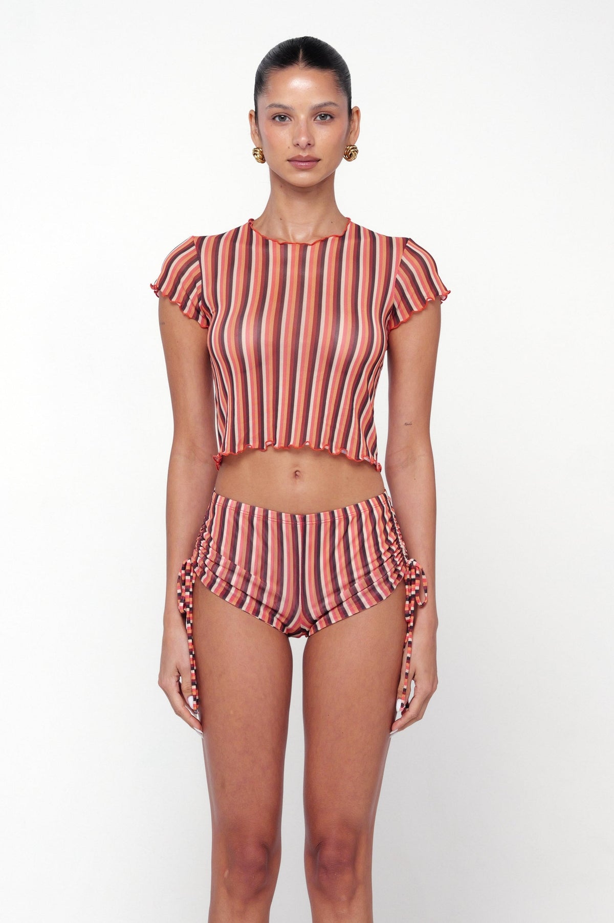 This is an image of Baby Tee in Studio 54 - RESA featuring a model wearing the dress