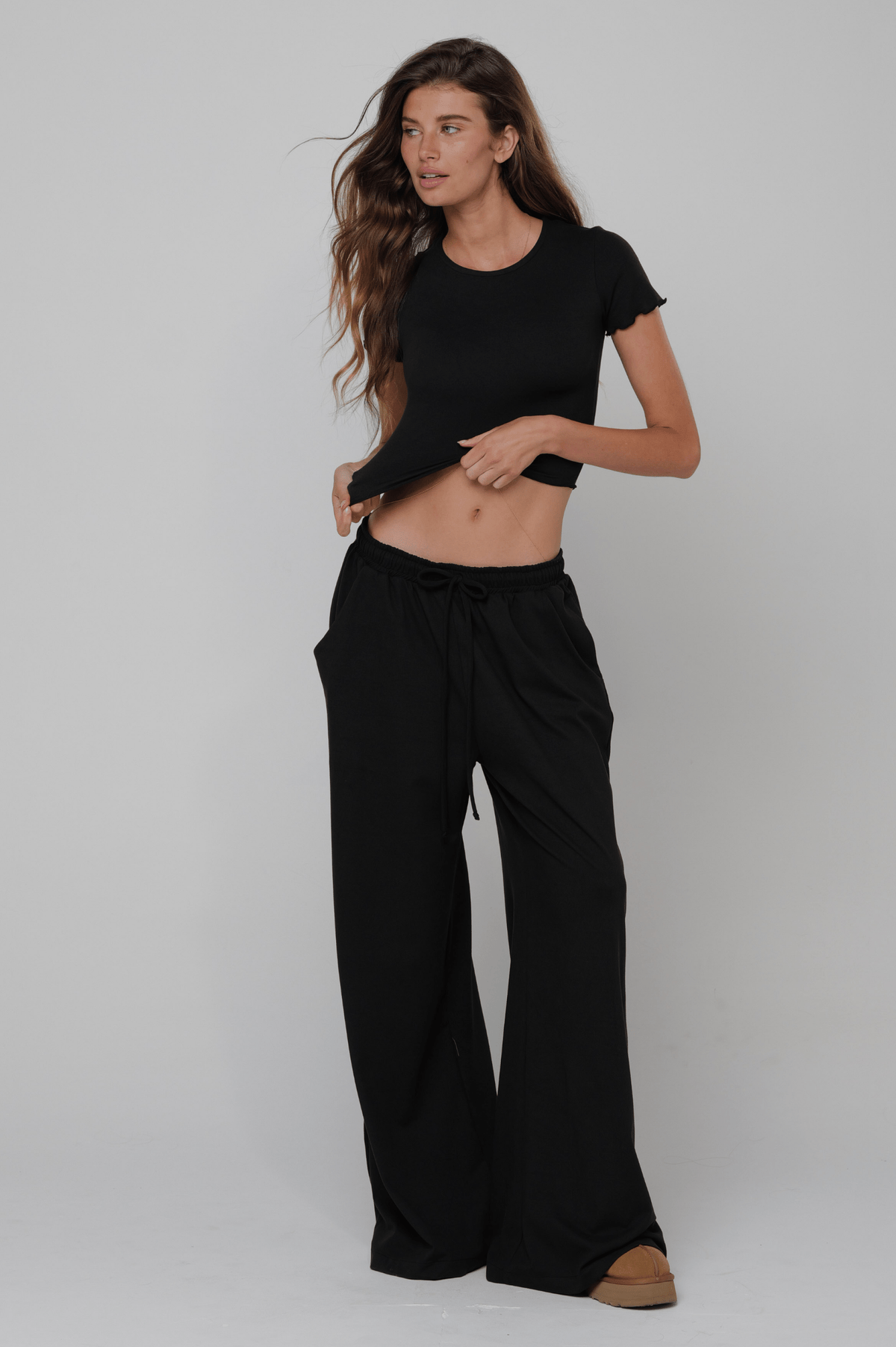 This is an image of Baby Tee Second Skin in Black - RESA featuring a model wearing the dress