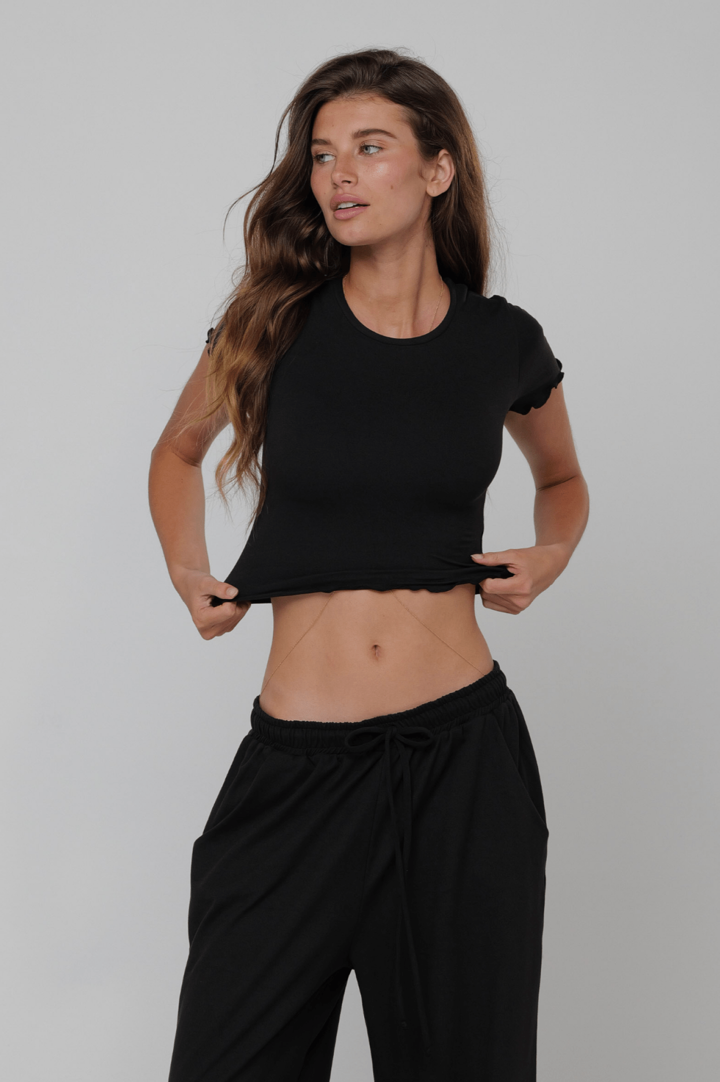 This is an image of Baby Tee Second Skin in Black - RESA featuring a model wearing the dress