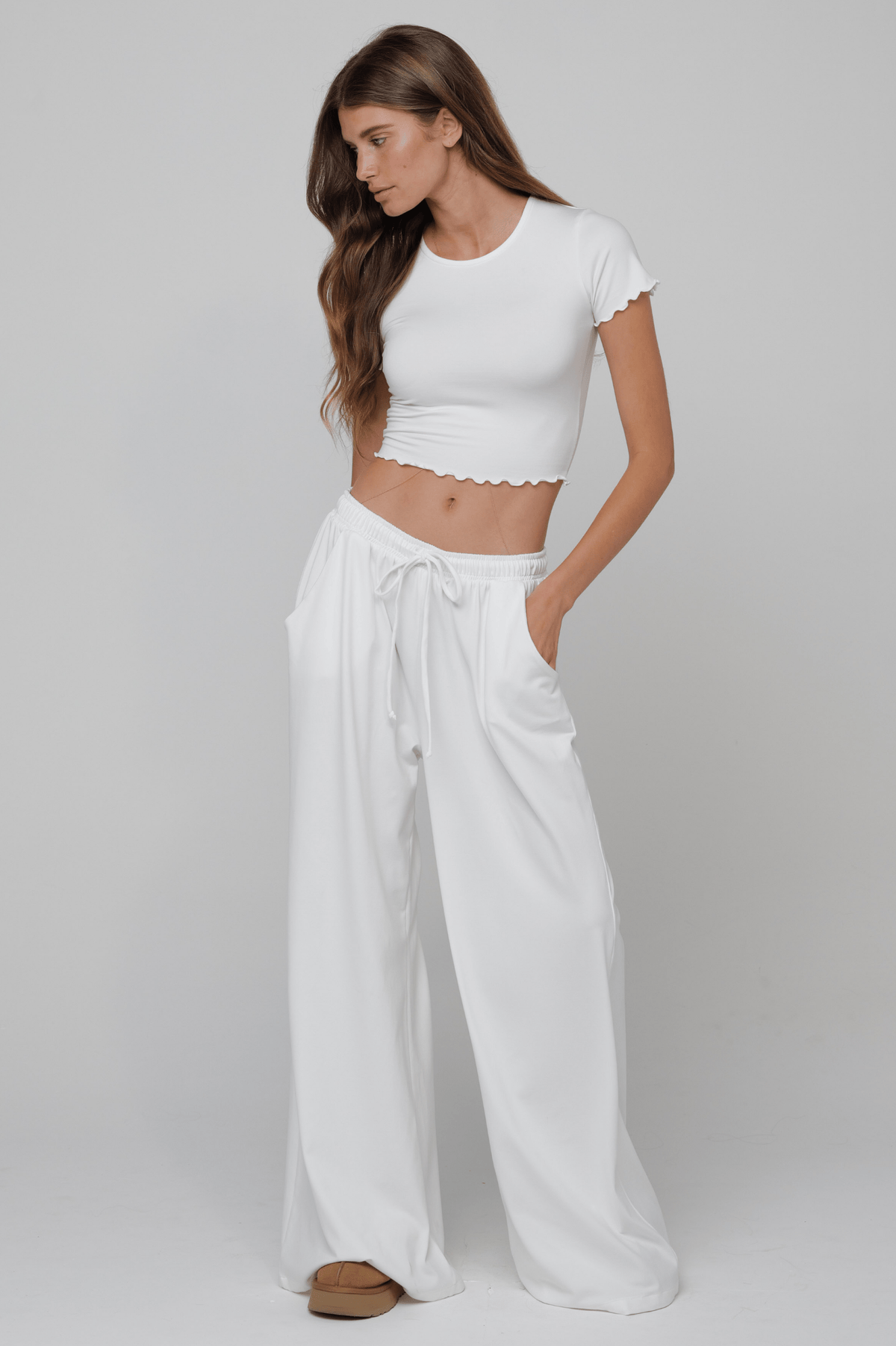 This is an image of Baby Tee Second Skin in White - RESA featuring a model wearing the dress