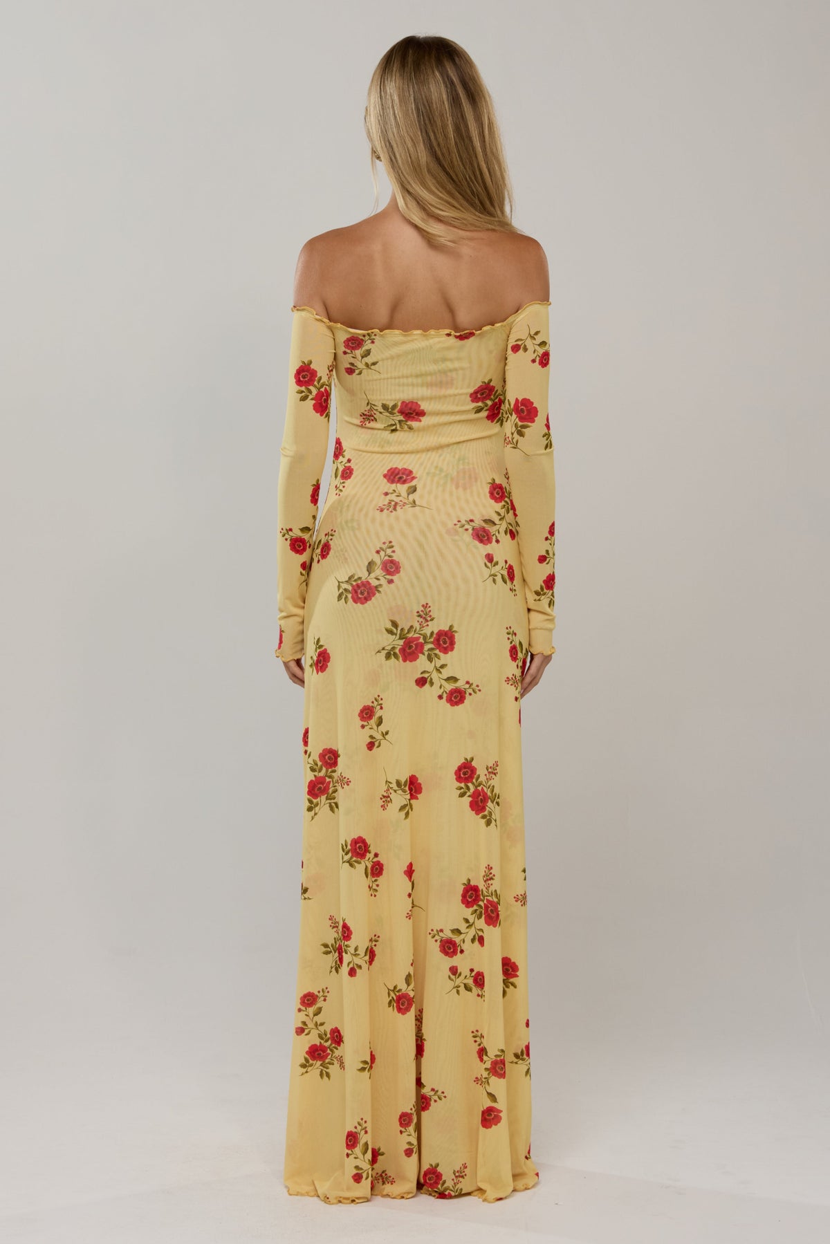This is an image of Bardot in Saffron - RESA featuring a model wearing the dress