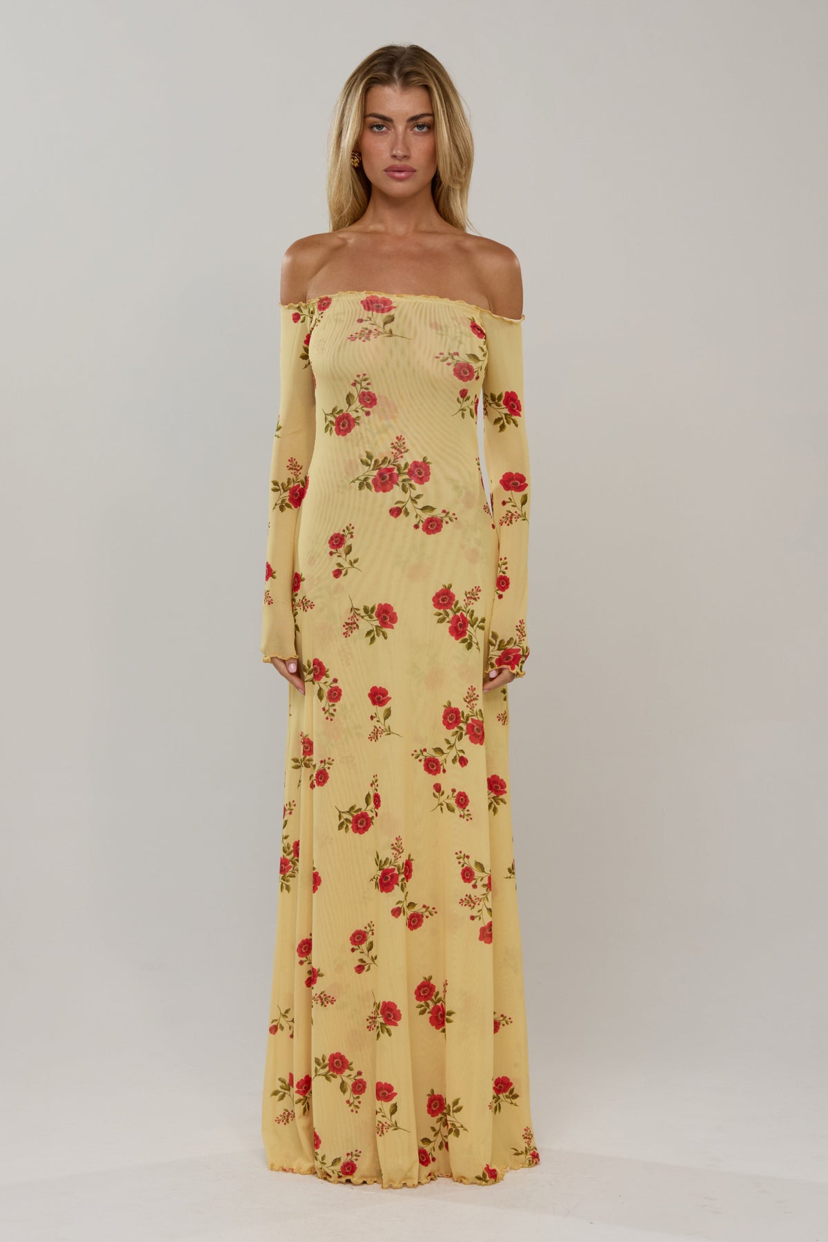 This is an image of Bardot in Saffron - RESA featuring a model wearing the dress