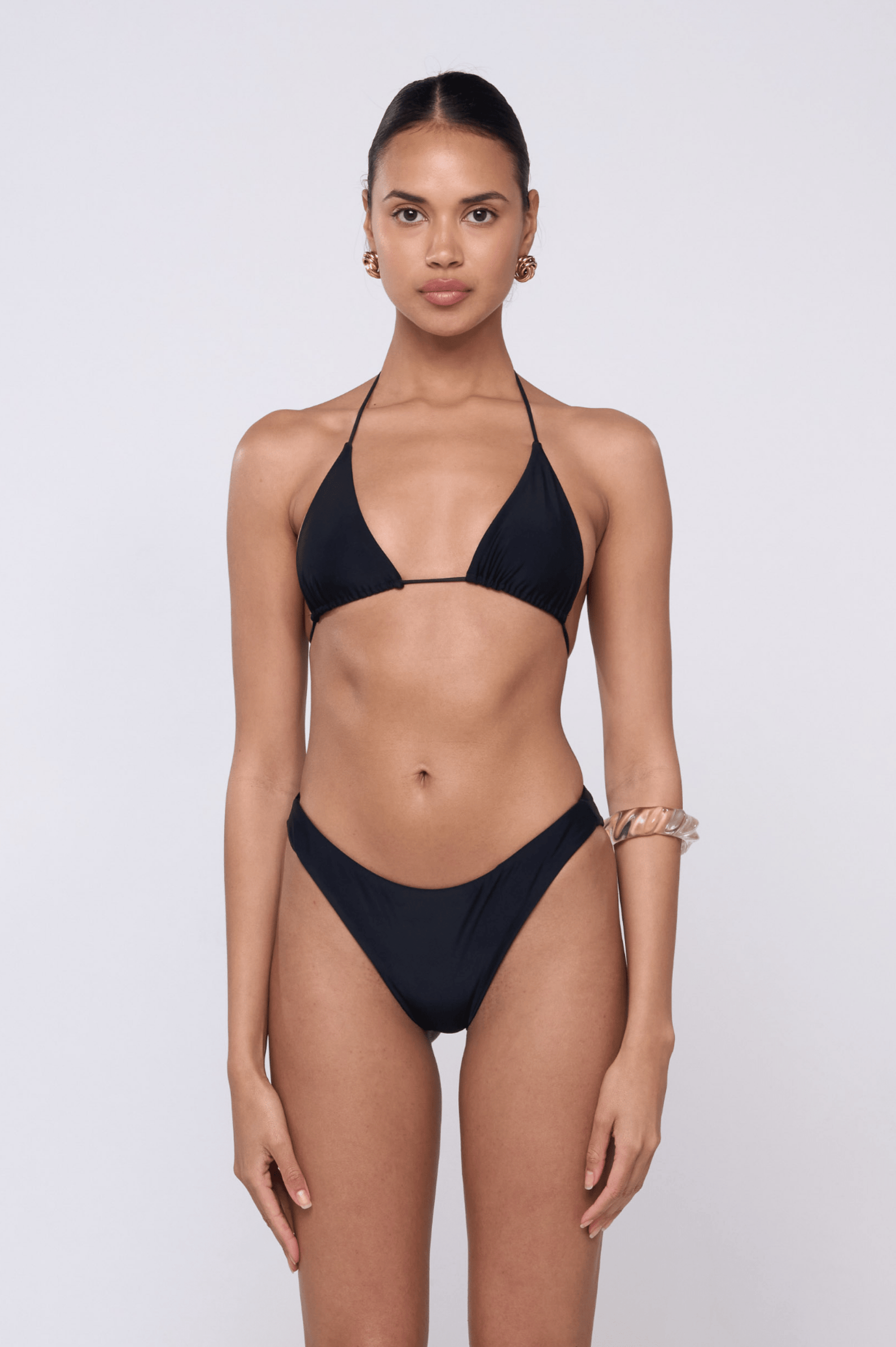This is an image of Beau Bikini Bottom in Black - RESA featuring a model wearing the dress