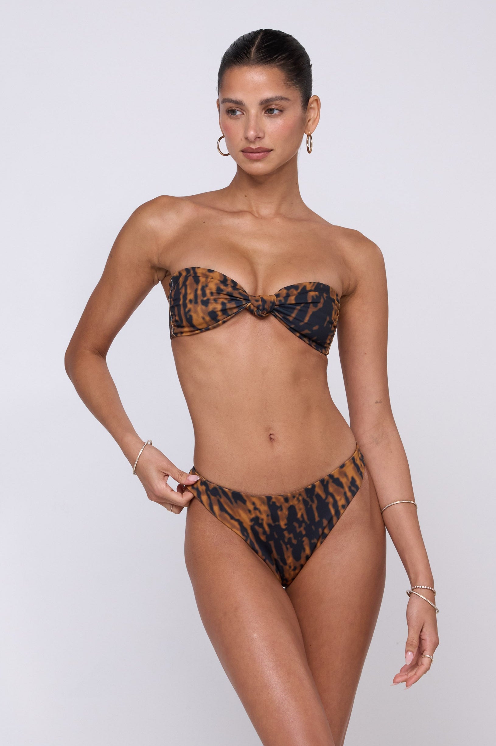This is an image of Beau Bikini Bottom in Bond - RESA featuring a model wearing the dress