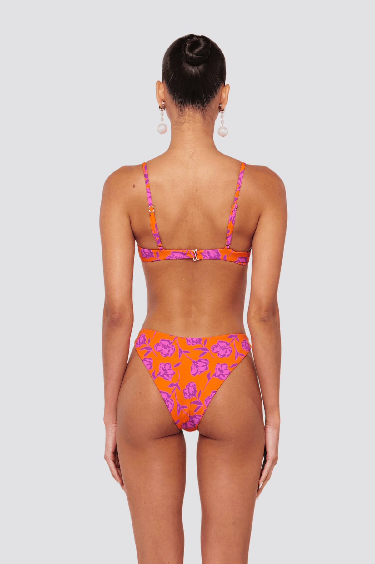 This is an image of Beau Bikini Bottom in Mandarin - RESA featuring a model wearing the dress