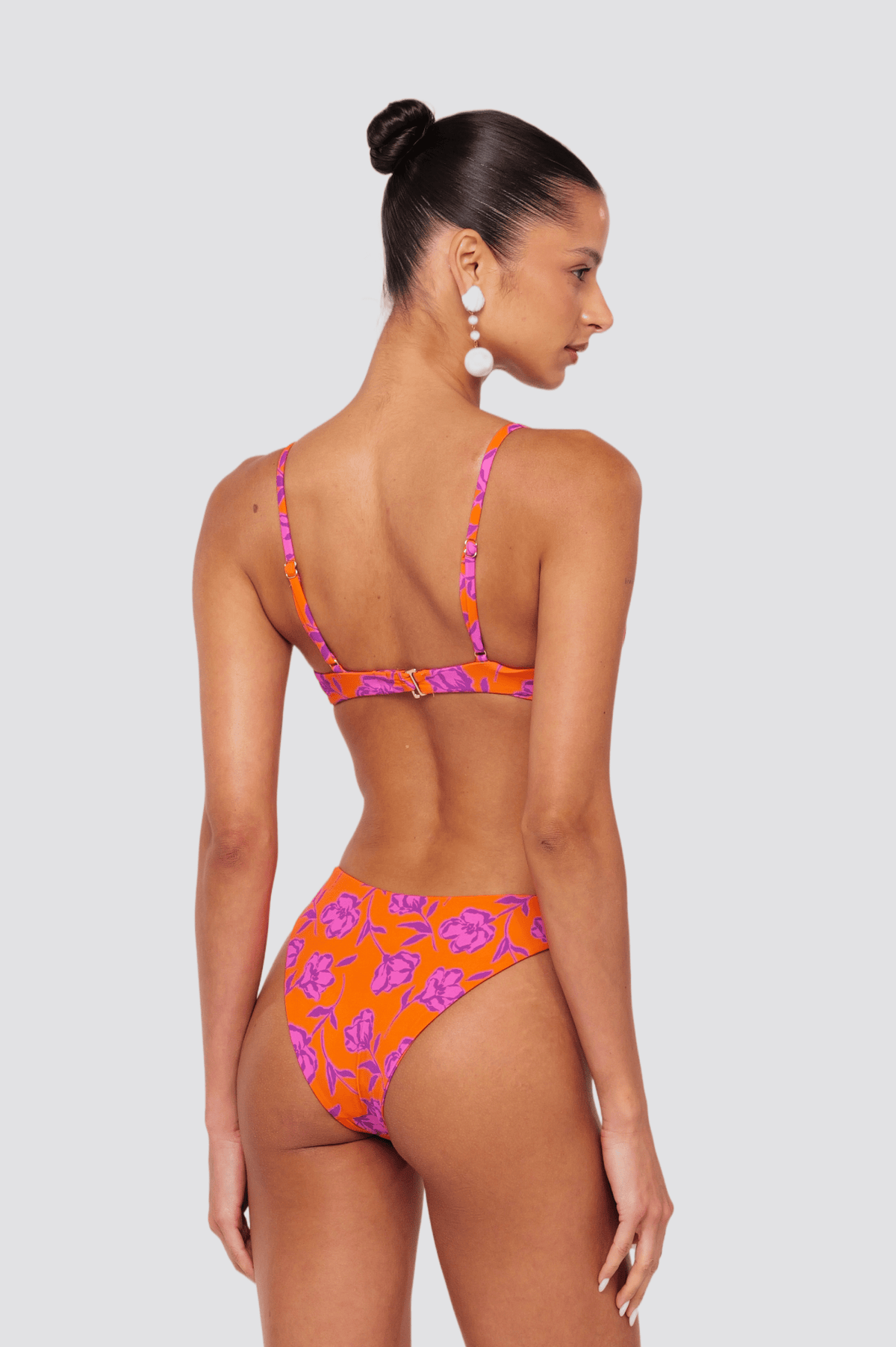 This is an image of Beau Bikini Bottom in Mandarin - RESA featuring a model wearing the dress
