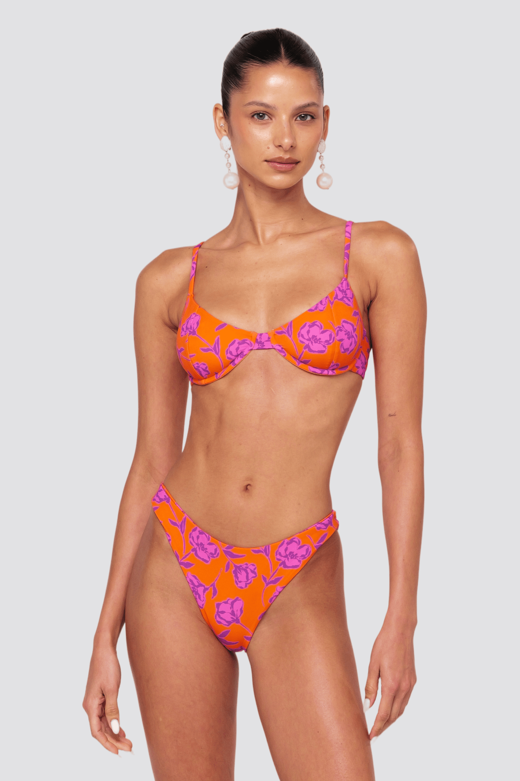This is an image of Beau Bikini Bottom in Mandarin - RESA featuring a model wearing the dress