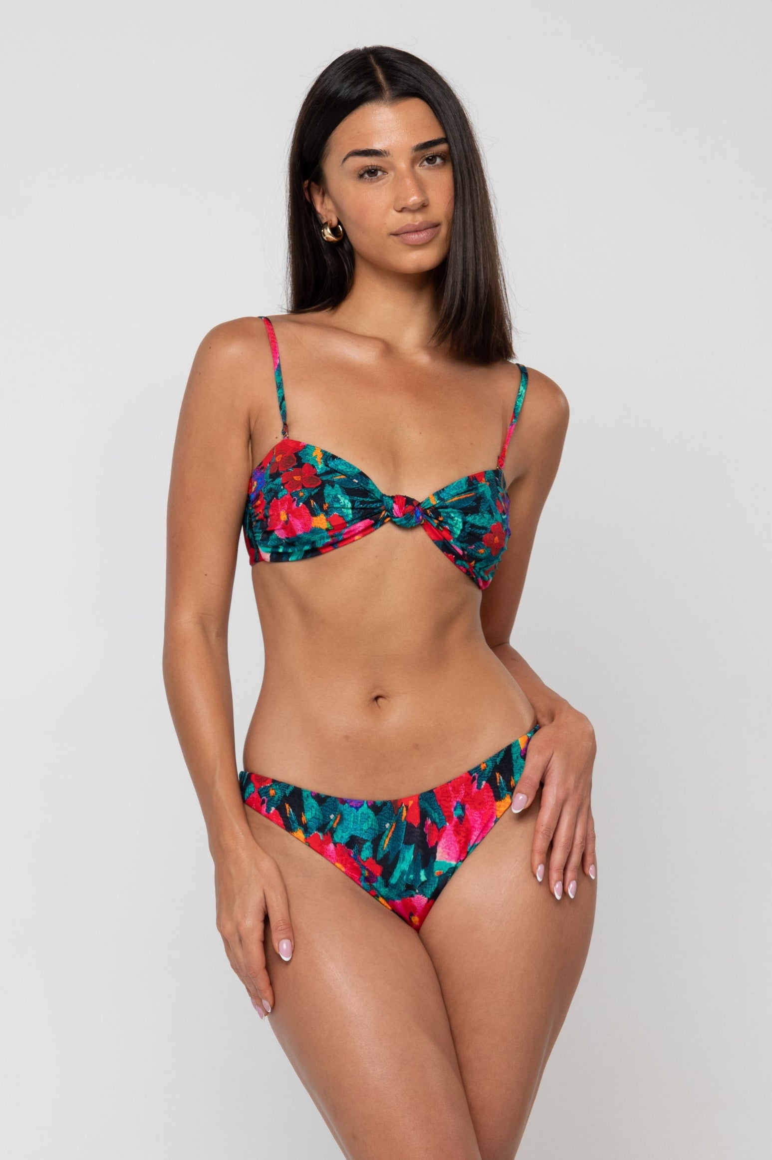 This is an image of Beau Bikini Bottom in Resort - RESA featuring a model wearing the dress