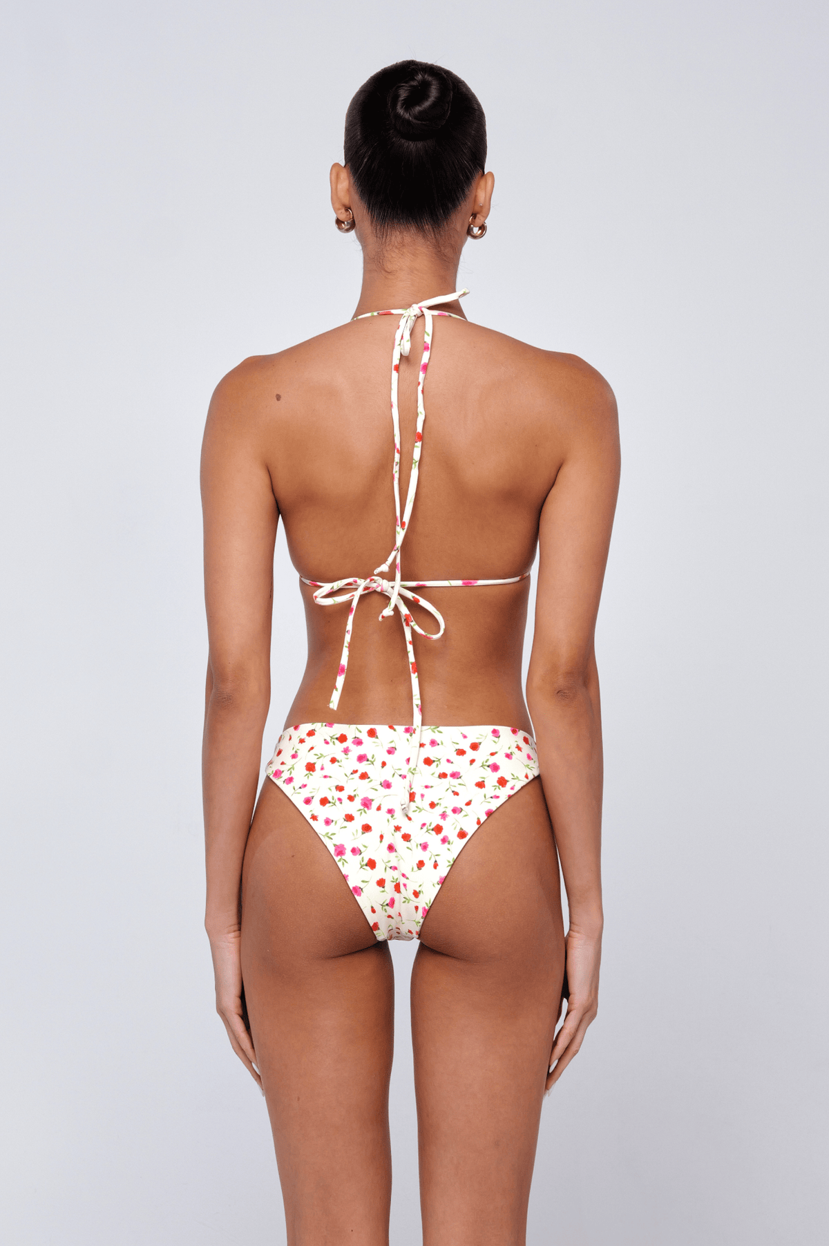 This is an image of Beau Bottom in Buttercream - RESA featuring a model wearing the dress