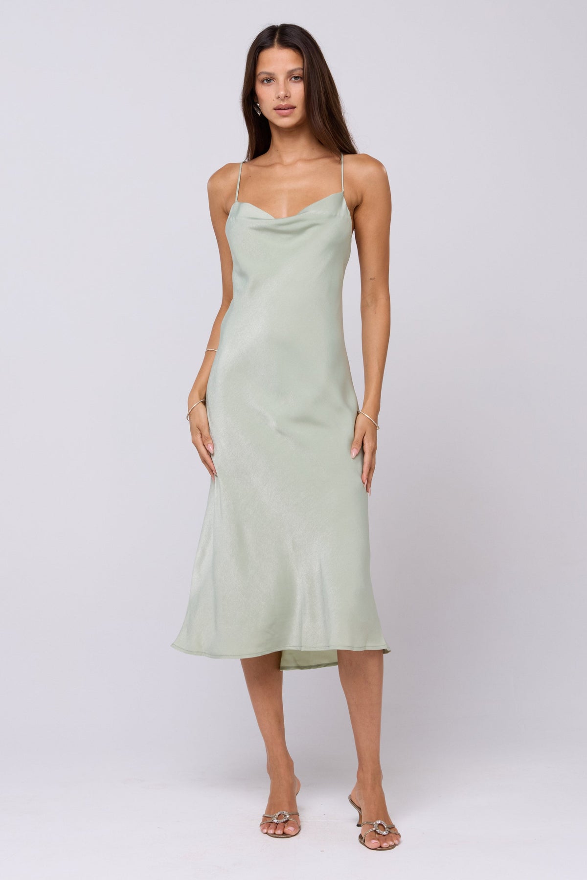 This is an image of Berri Slip in Sage - RESA featuring a model wearing the dress