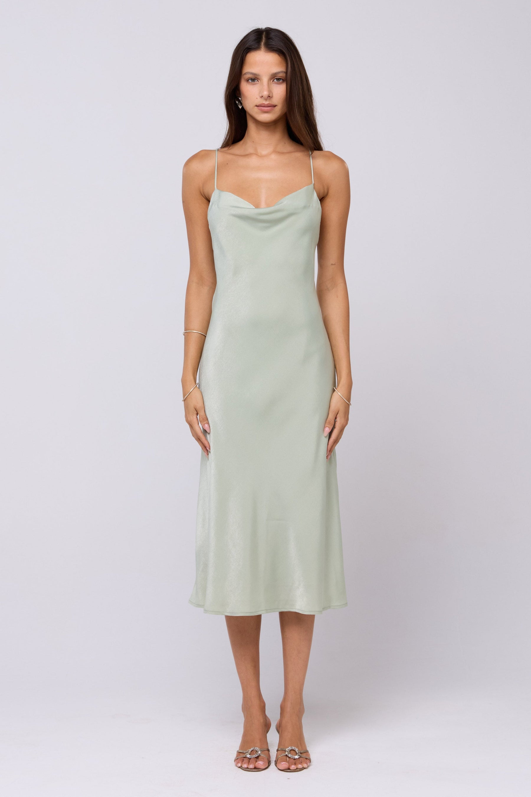 This is an image of Berri Slip in Sage - RESA featuring a model wearing the dress