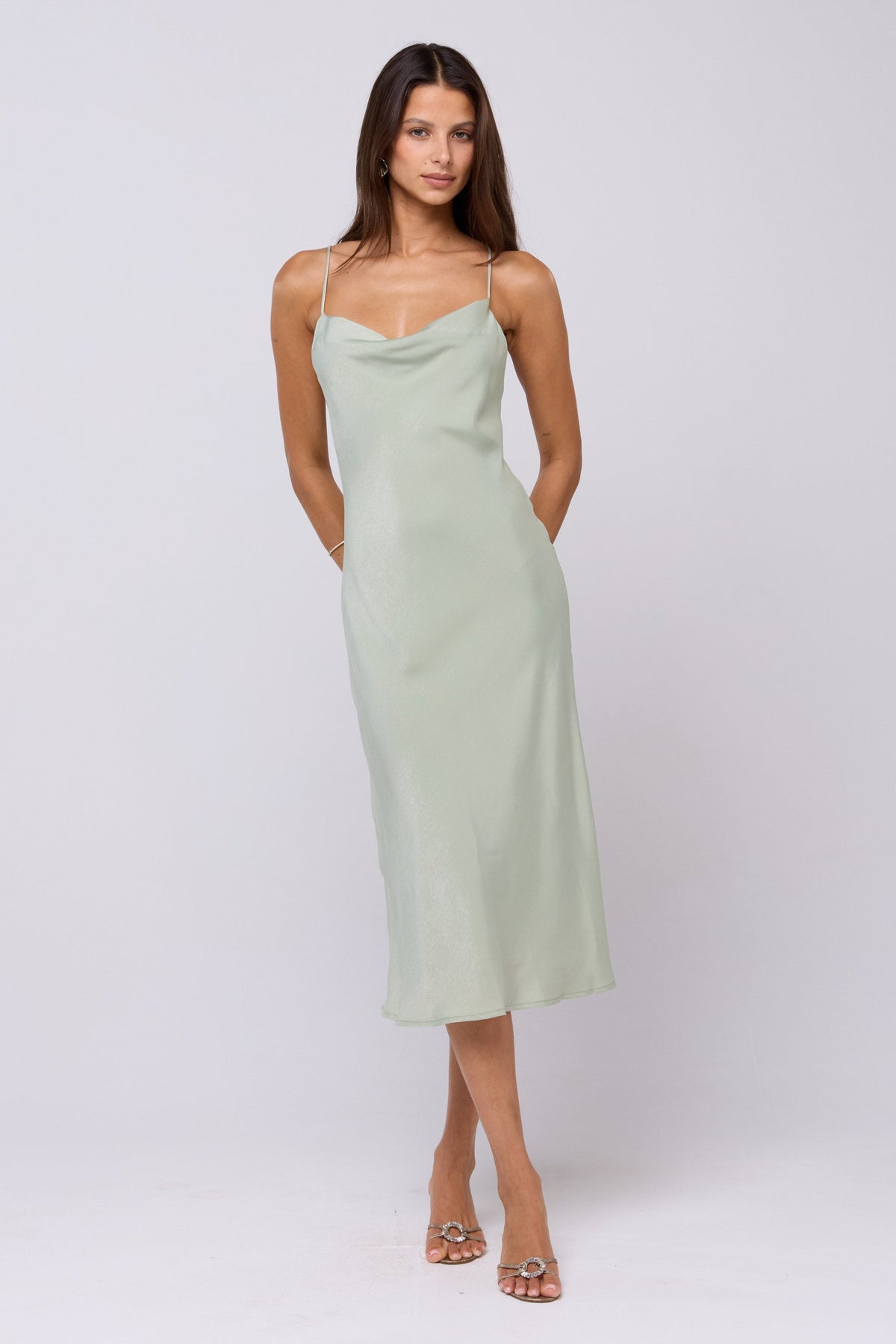 This is an image of Berri Slip in Sage - RESA featuring a model wearing the dress