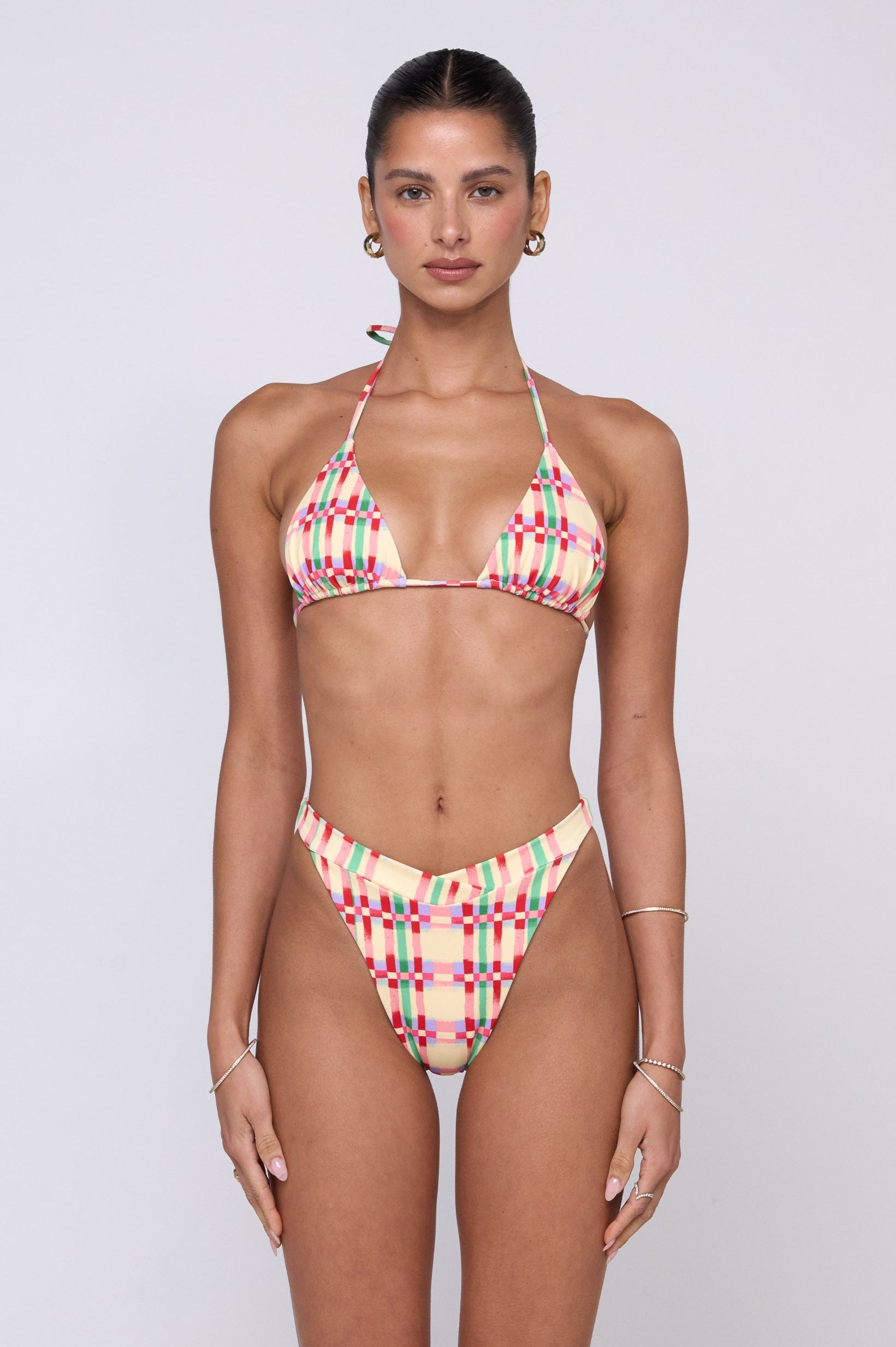 This is an image of Betsy Bikini Bottom in Plaid - RESA featuring a model wearing the dress