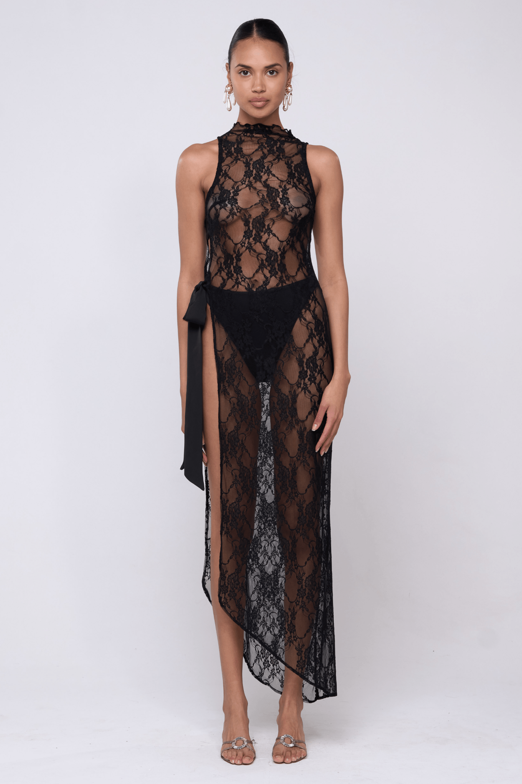 This is an image of Bow Dress in Black Lace - RESA featuring a model wearing the dress