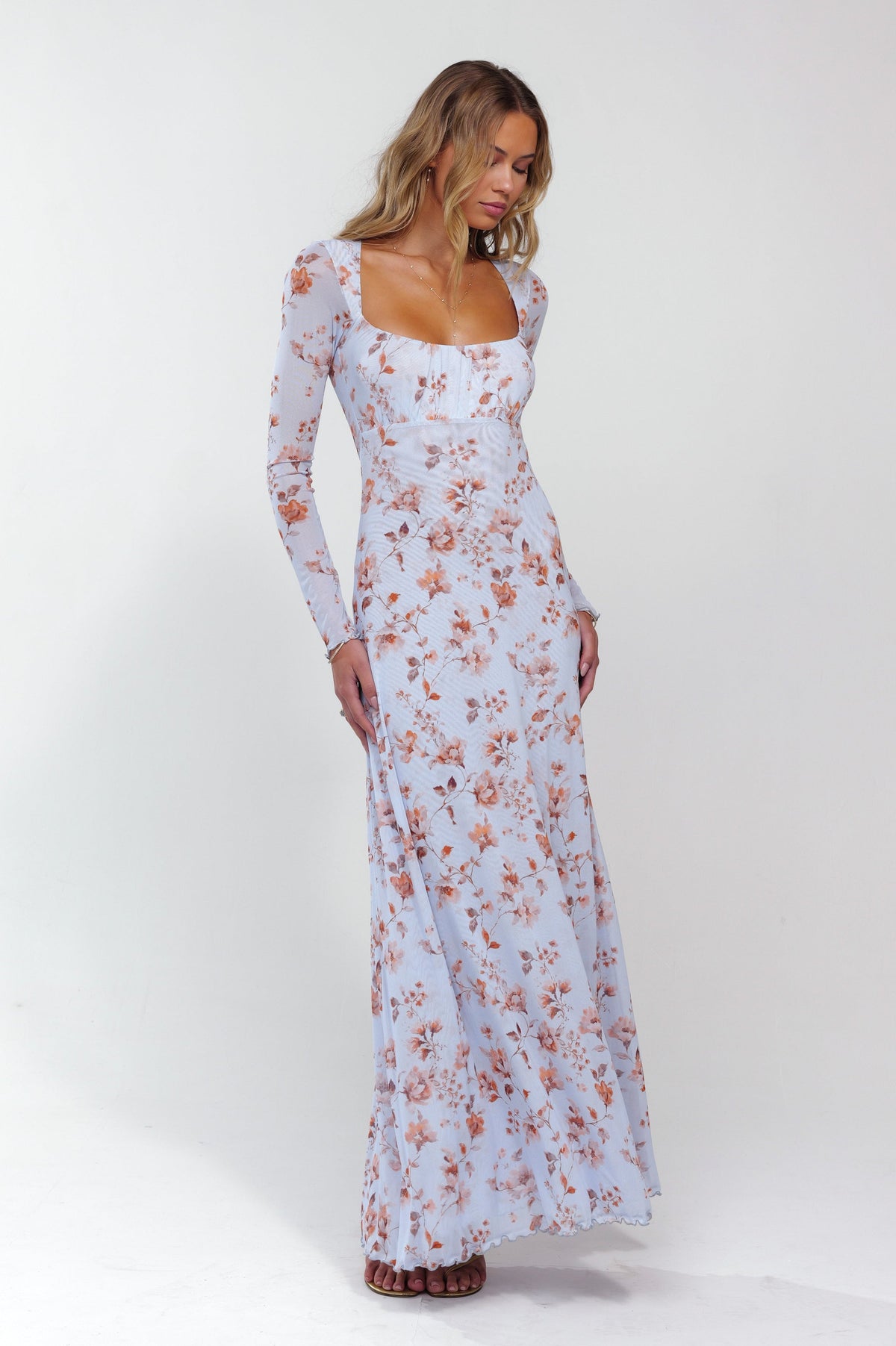 This is an image of Brittany Dress in Whimsy - RESA featuring a model wearing the dress