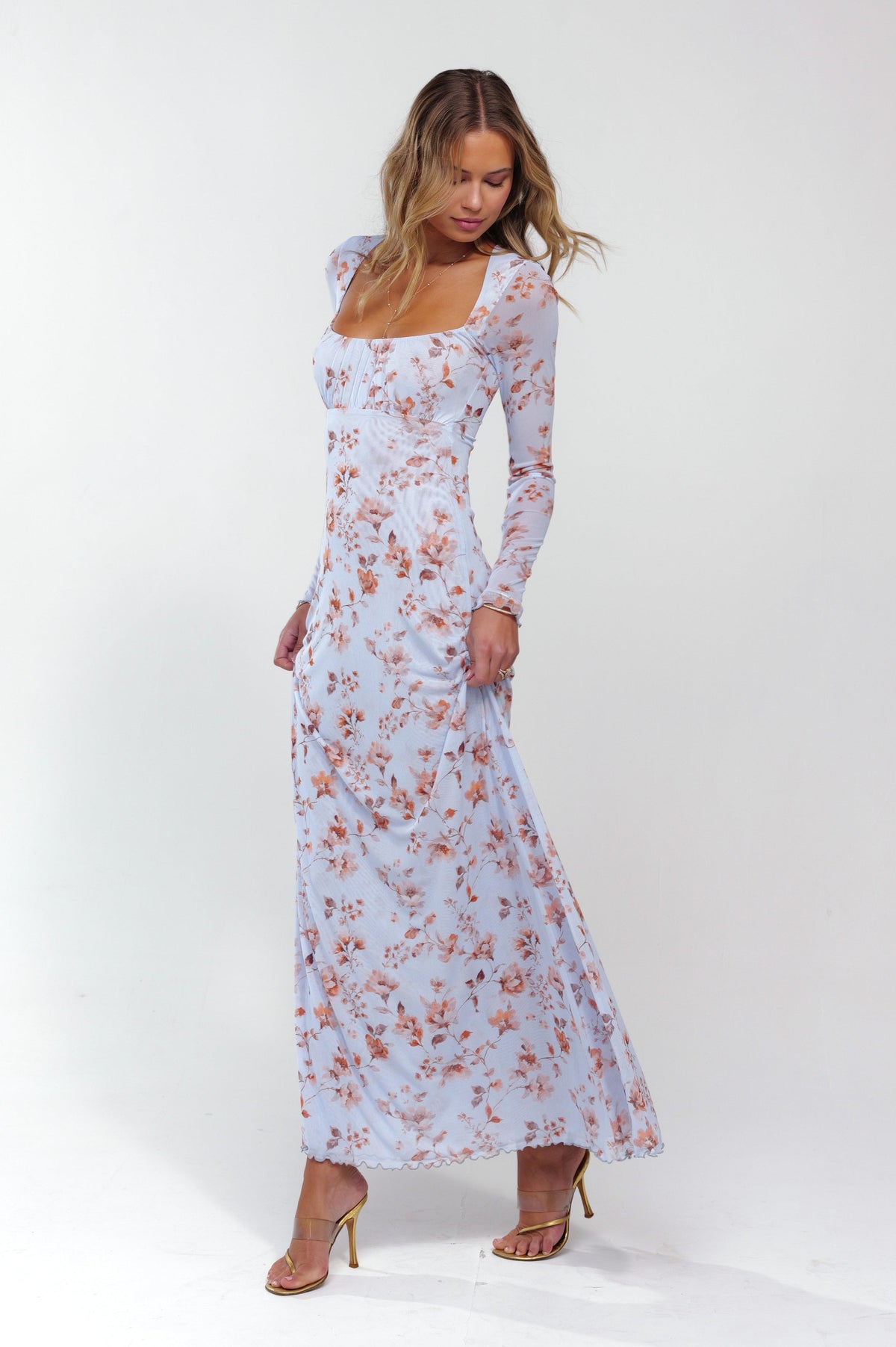 This is an image of Brittany Dress in Whimsy - RESA featuring a model wearing the dress