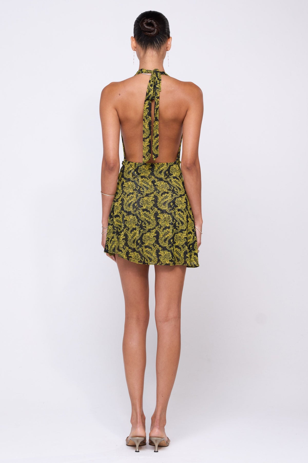 This is an image of Bruna Dress in Sorrento - RESA featuring a model wearing the dress