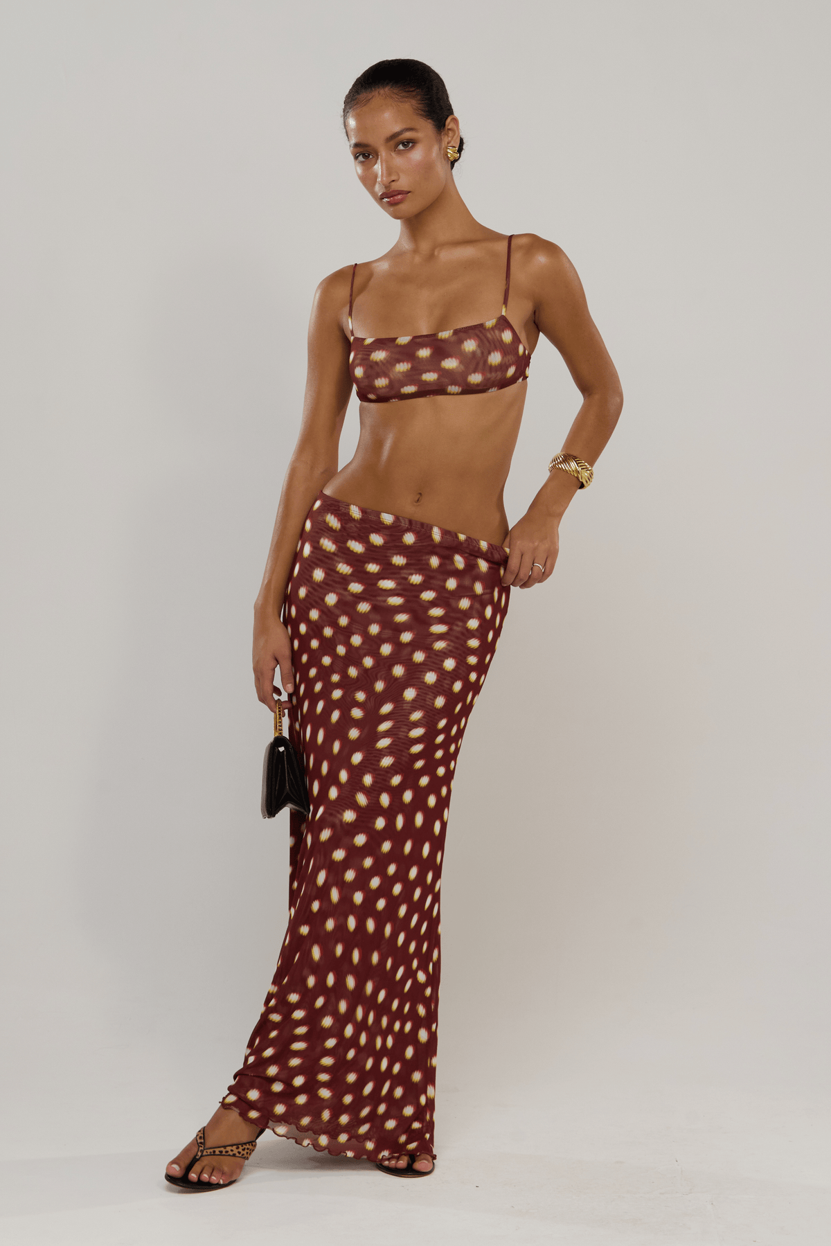 This is an image of Caro in Spice - RESA featuring a model wearing the dress