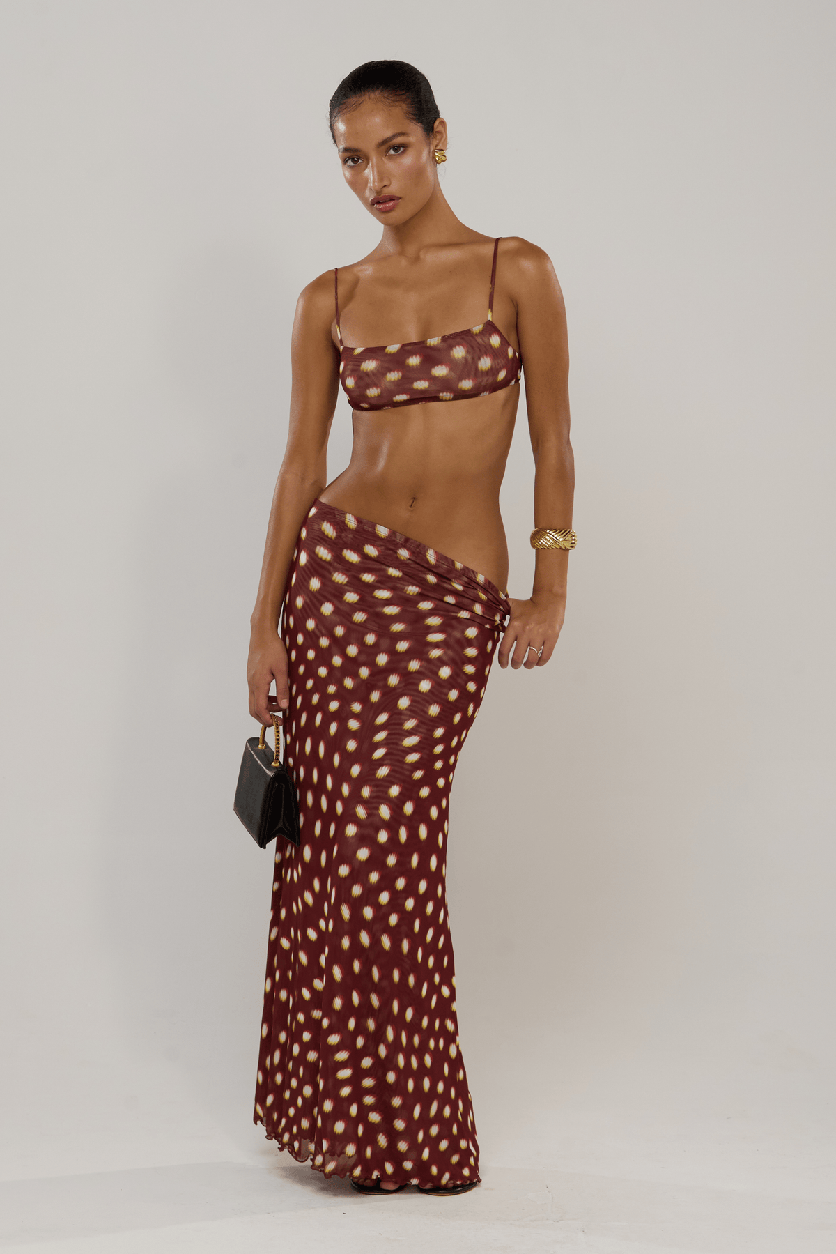 This is an image of Caro in Spice - RESA featuring a model wearing the dress