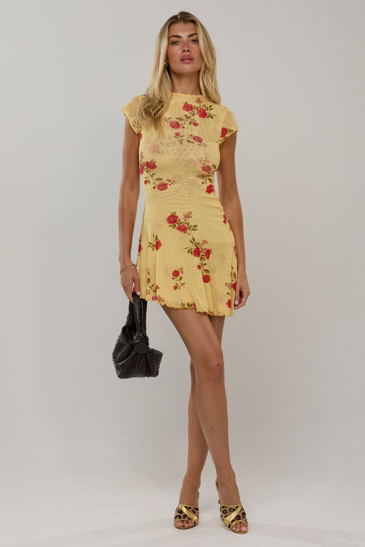 This is an image of Cece in Saffron - RESA featuring a model wearing the dress