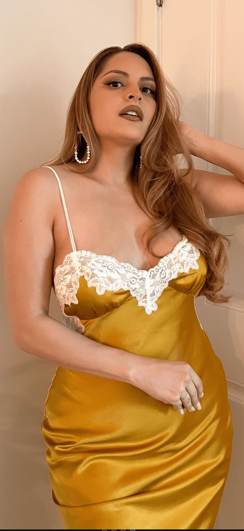 This is an image of Celine Dress in Gold - RESA featuring a model wearing the dress