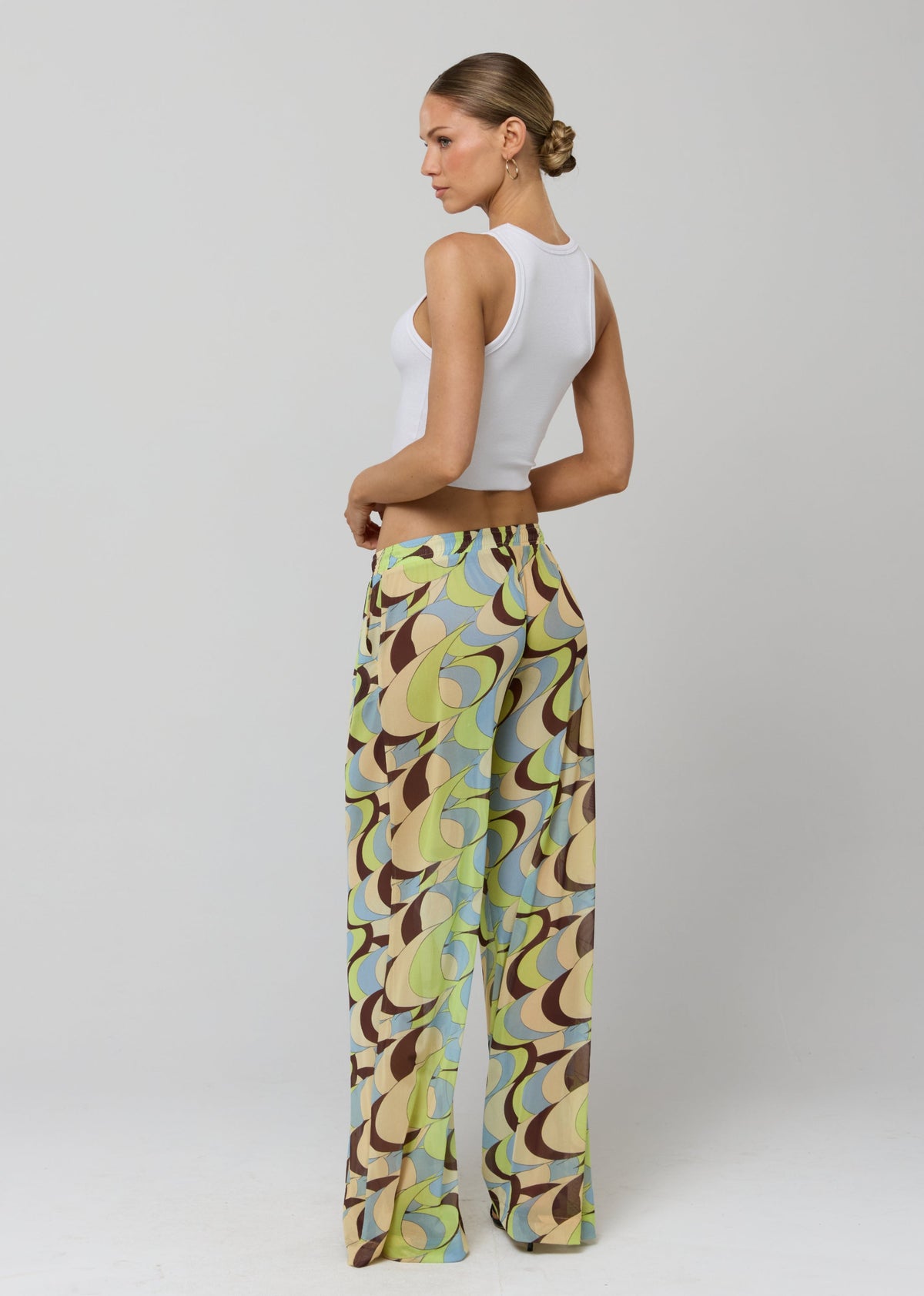 This is an image of Chase Mesh Pant in Palm Royale - RESA featuring a model wearing the dress